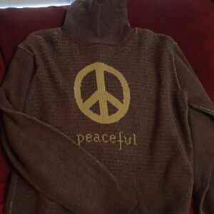 Cozy Brown Turtleneck Sweater with Peaceful Design